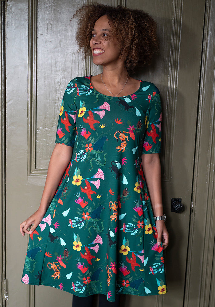 Front view of Mhairi Jungle Story Print Dress, our jersey is a smooth, stretchy fabric known for its comfort and ease.