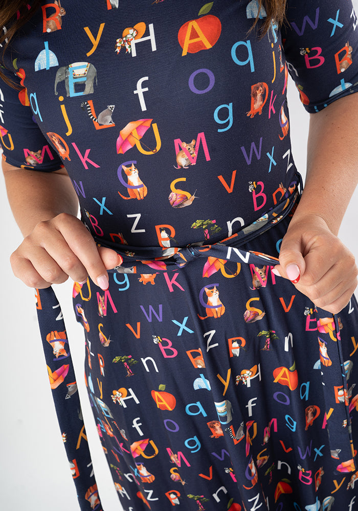 Navy blue midi dress with colourful alphabet phonics pattern