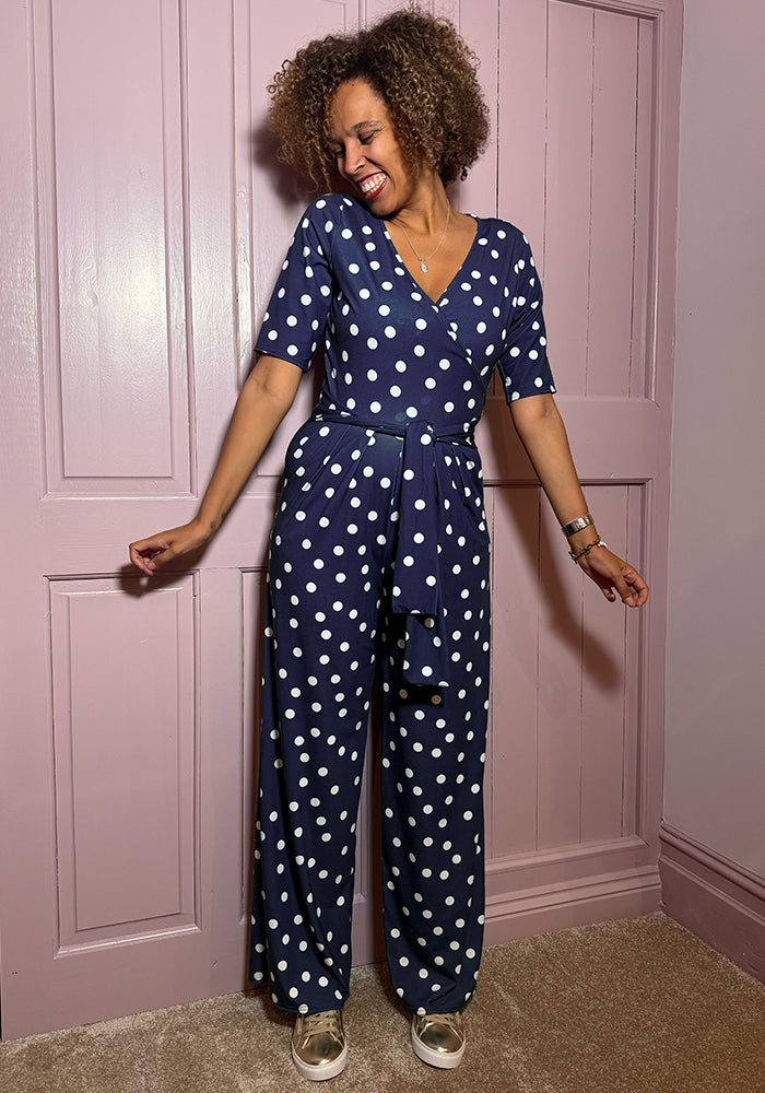 Front view of Kiri Navy Spot Full Length Jumpsuit, our jersey is a smooth, stretchy fabric known for its comfort and ease.