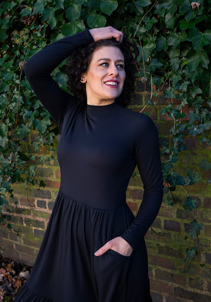 Lilah Black Turtle Neck Tiered Hem Dress