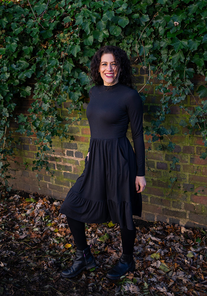 Lilah Black Turtle Neck Tiered Hem Dress