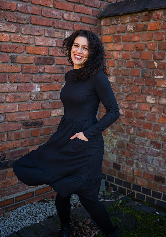 Lilah Black Turtle Neck Tiered Hem Dress