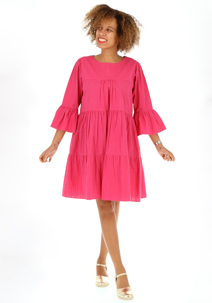 Third angle of Mayliss Pink Textured Woven Cotton Tiered Dress