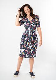 Woman wearing a floral bird dress 