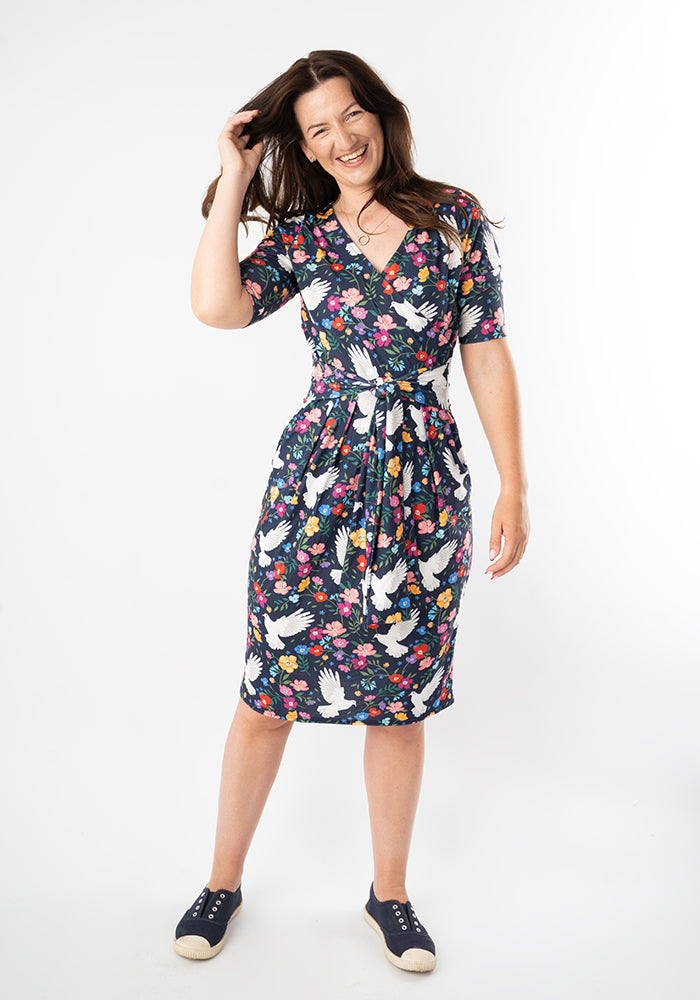 Woman wearing a floral bird dress 