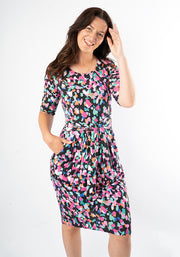 Woman wearing a colourful patterned animal print dress