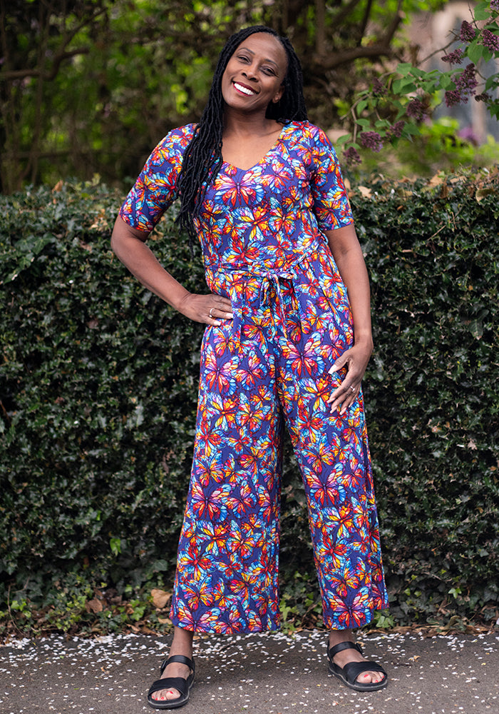 Front view of Nigella Stained Glass Butterfly Print Viscose Culotte Leg Jumpsuit