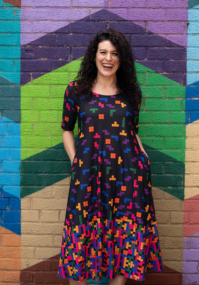 Front view of Ona Falling Blocks Border Print Midi Dress