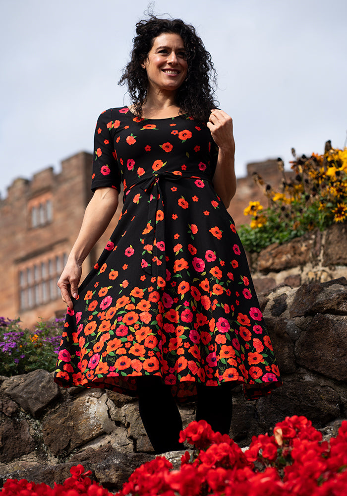 Front view of Parisa Poppy Border Print Cotton Swing Dress