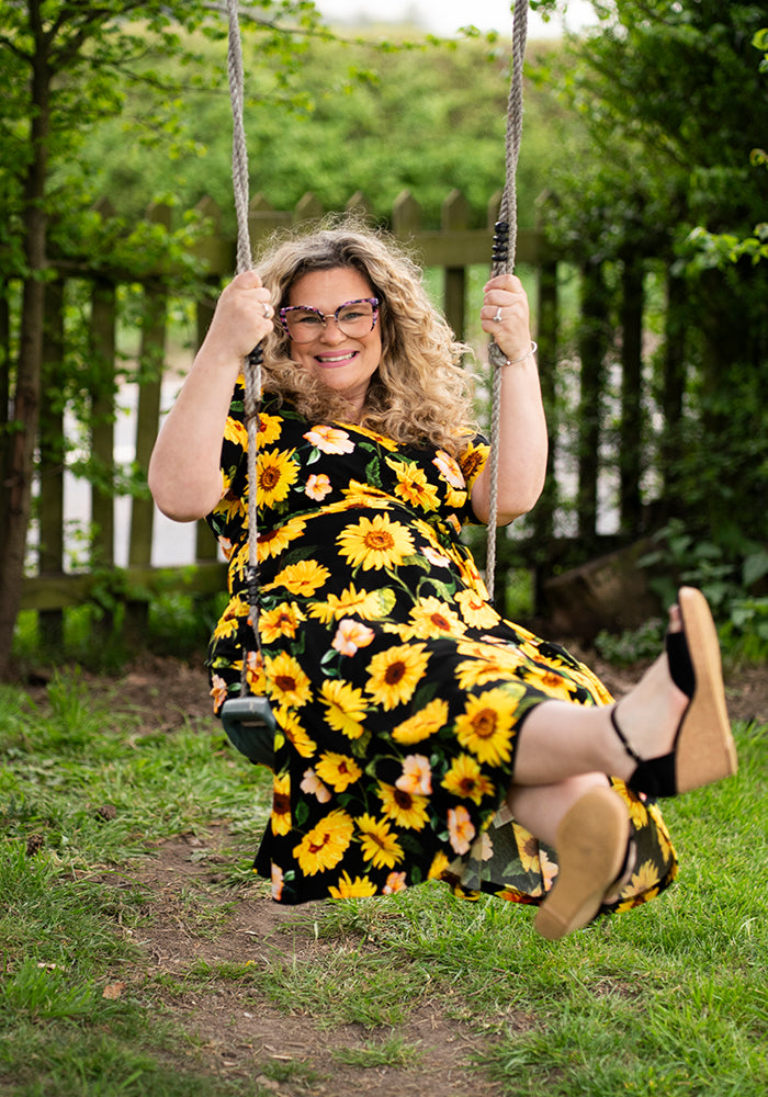 Ninth angle of Philomena Black Sunflower Print Cotton Swing Dress