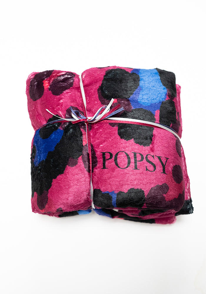 Front view of Pop-under Large Scale Pink Animal Print Plush Blanket