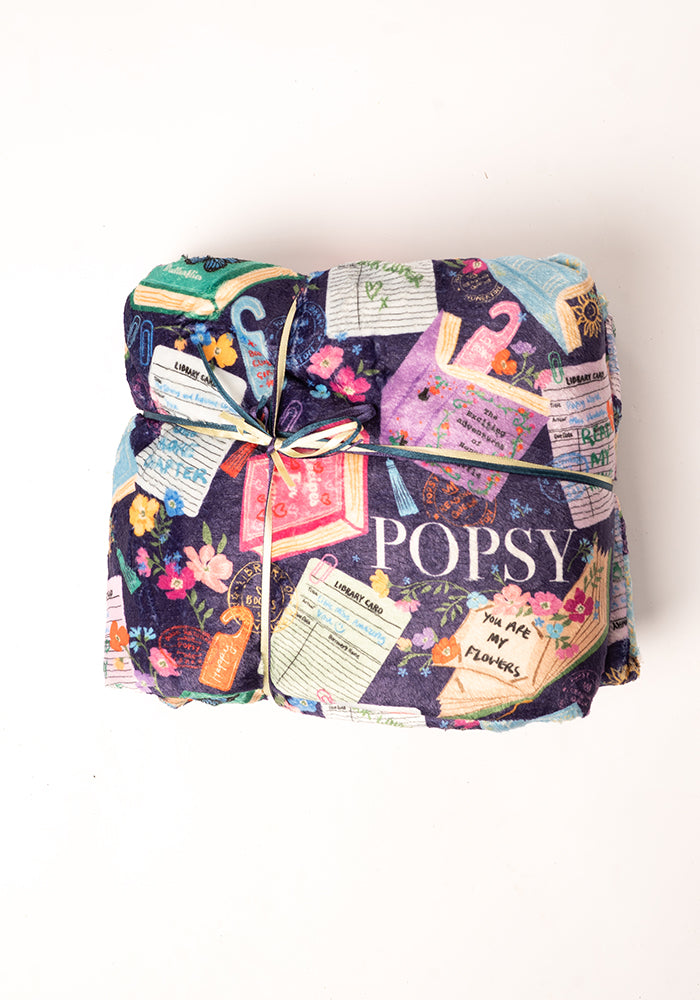 Front view of Purple Library Books Print Plush Blanket (Pop-Under), library Book Print Plush Blanket.