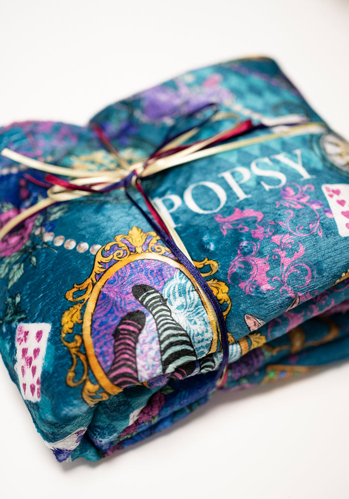 Front view of Pop-under Looking Glass Print Plush Blanket