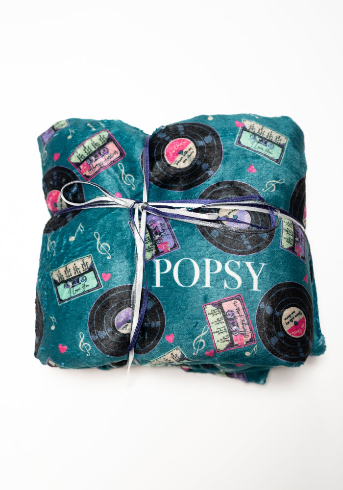 Front view of Pop-under Mixtapes Print Plush Blanket
