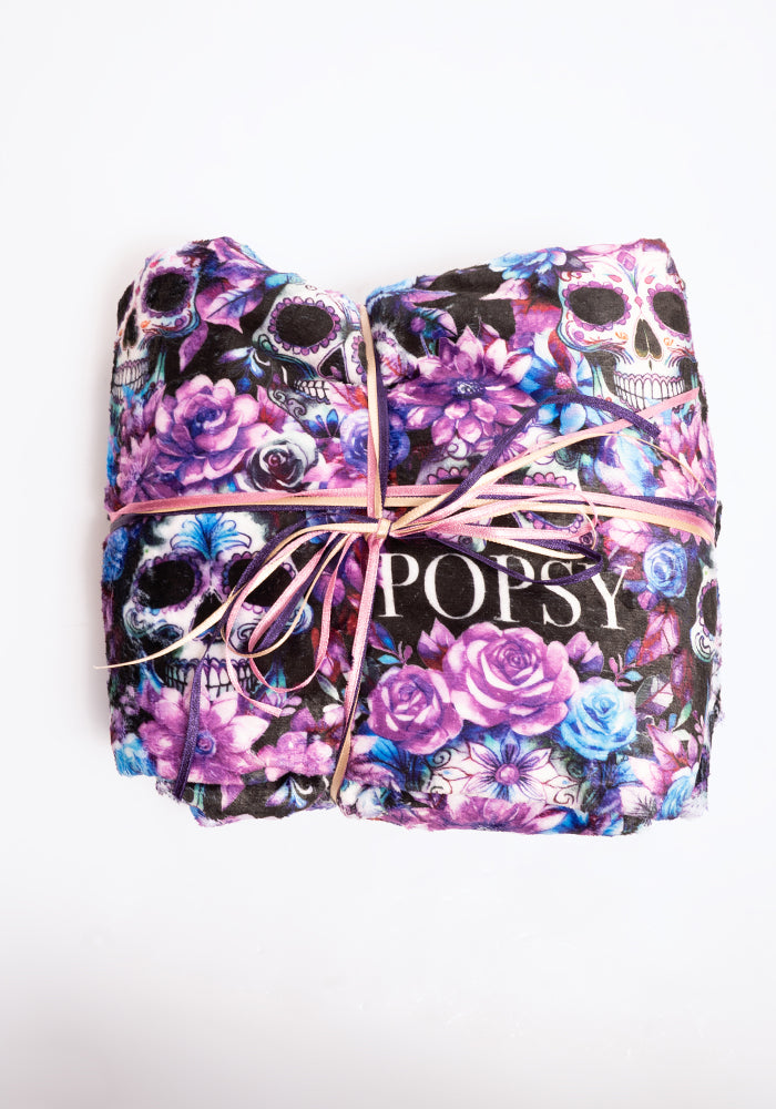Front view of Purple Floral Skulls Plush Throw Blanket (Pop-Under)
