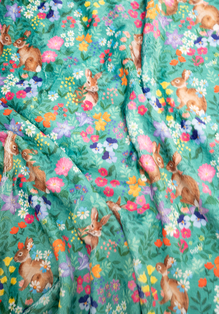 Seventh angle of Rabbit Garden Print Plush Throw Blanket (Pop-Under)