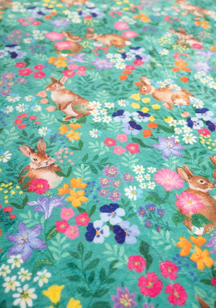 Fourth angle of Rabbit Garden Print Plush Throw Blanket (Pop-Under)