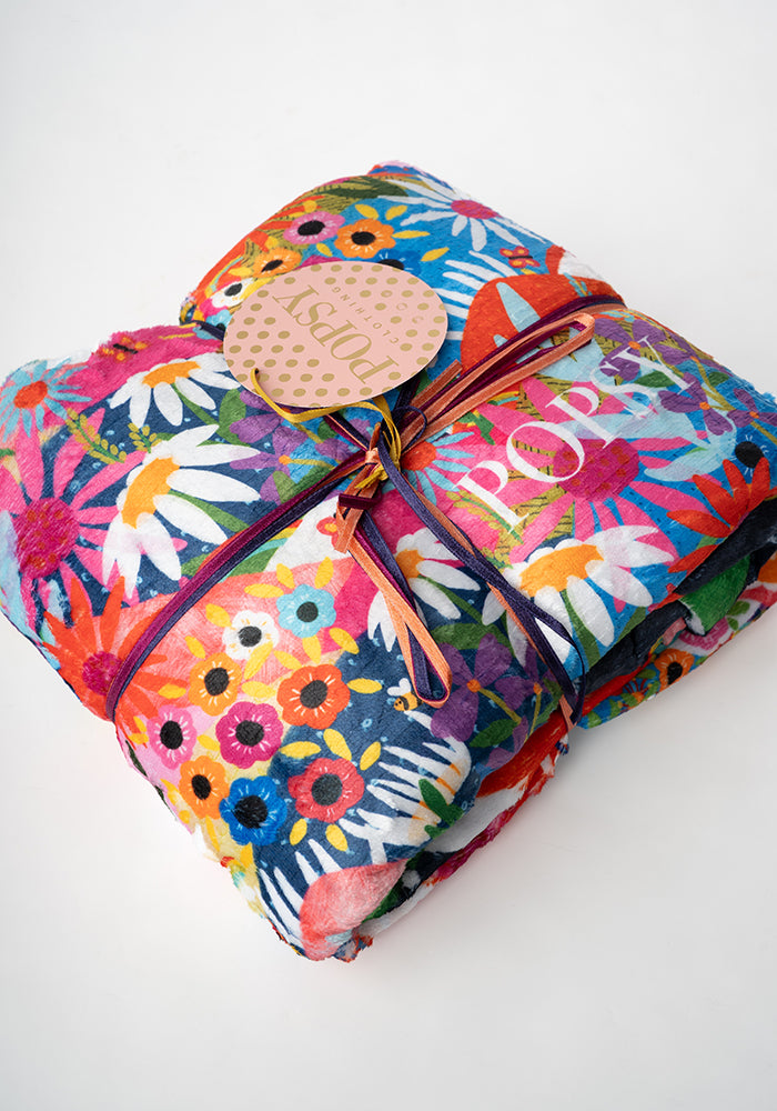 Front view of Pop-under Rainbow Border Print Plush Blanket