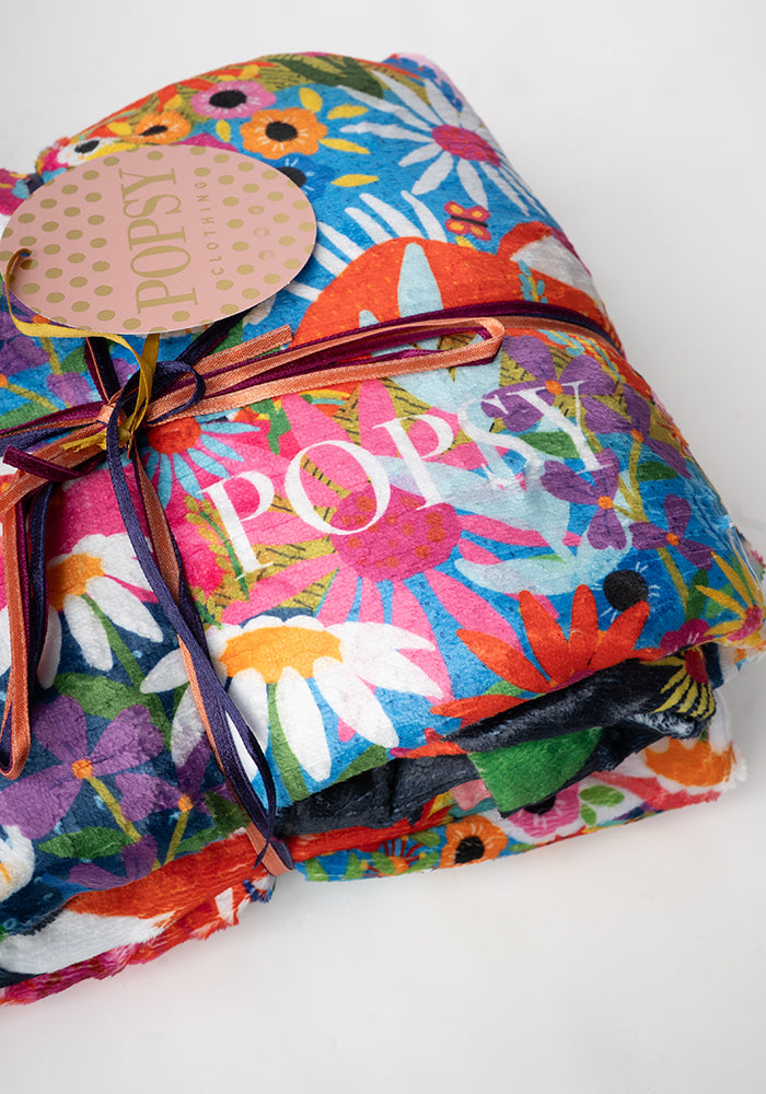 Third angle of Pop-under Rainbow Border Print Plush Blanket