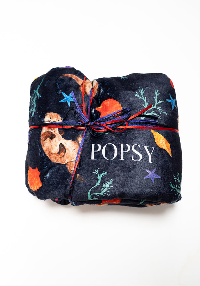 Front view of Sea Otter Print Plush Throw Blanket (Pop-Under)