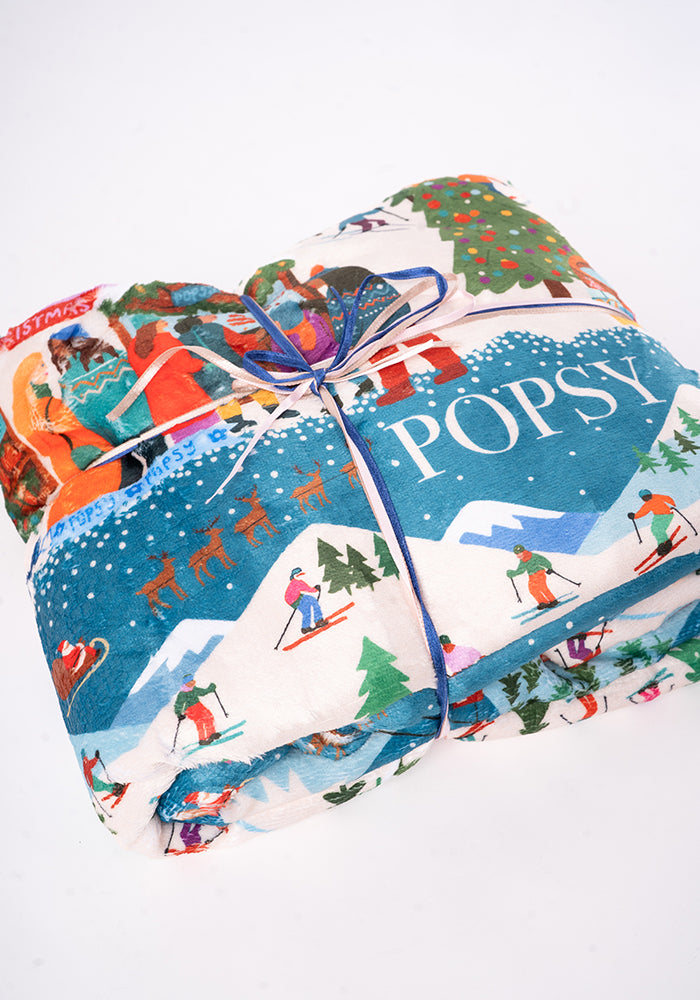 Pop-under Ski Village Print Plush Blanket