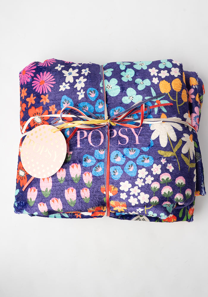 Front view of Pop-under Wild Flower Print Plush Blanket
