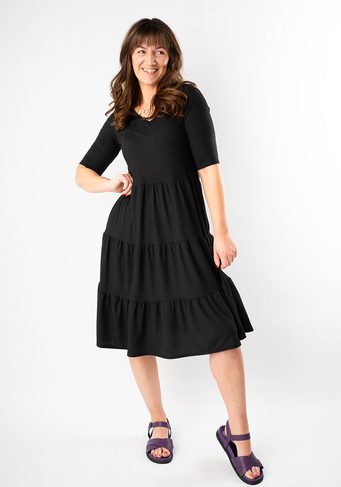 Third angle of Reed Black Rib Brush Tiered Hem Dress