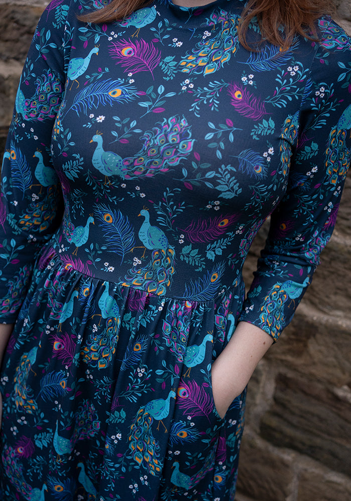 Third angle of Rosalie Peacock Print Tiered Hem Midi Dress