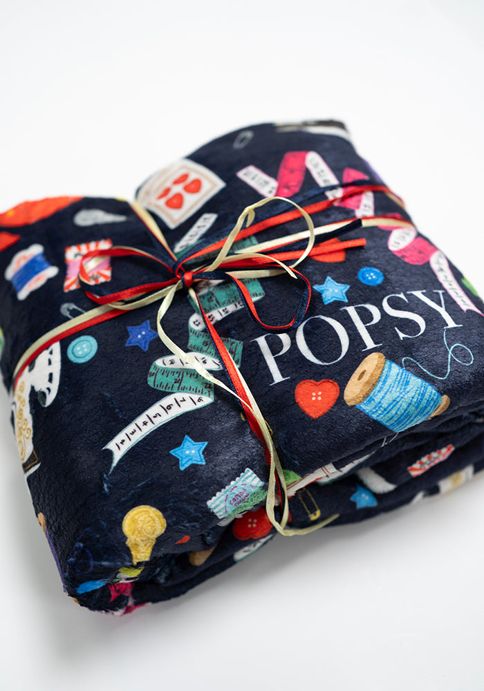 Front view of Sewing &amp; Haberdashery Print Pop-under Plush Blanket