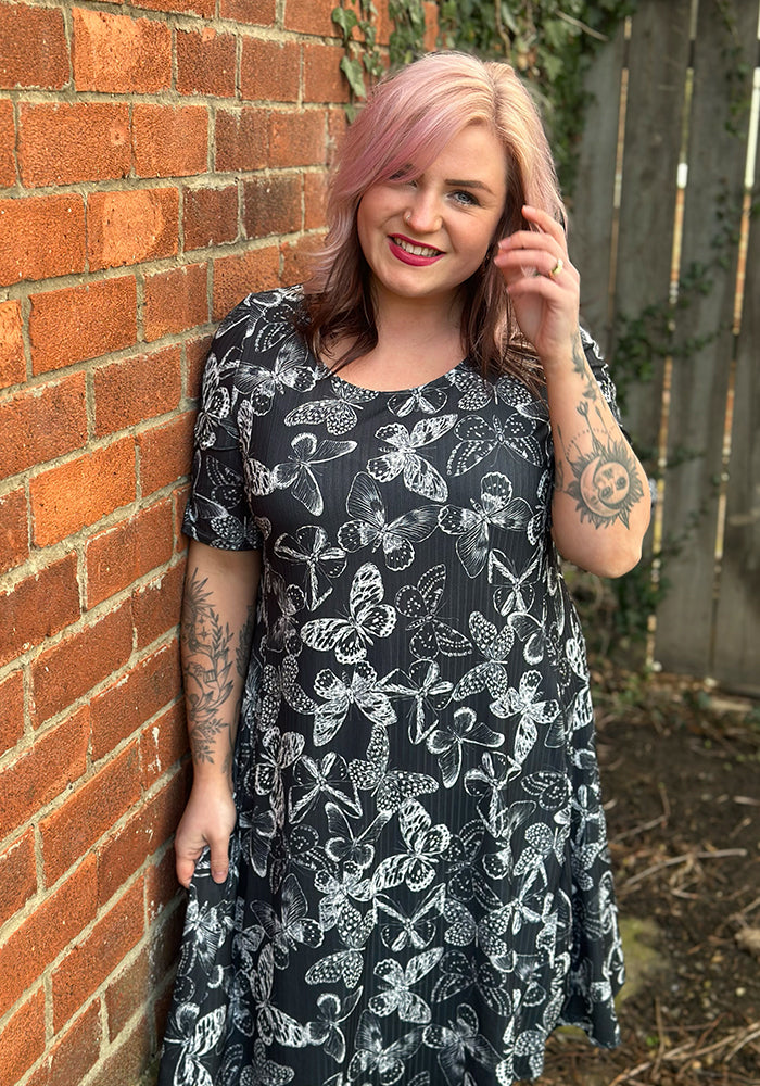 Front view of Skyla Mono Butterfly Print Trapeze Dress