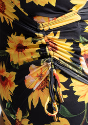 Close-up of a sunflower swimsuit with yellow flowers on a black background