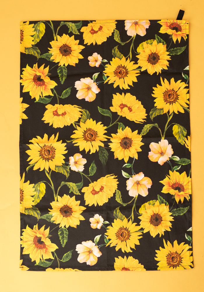 Front view of Black Sunflower Print Popsy Tea Towel