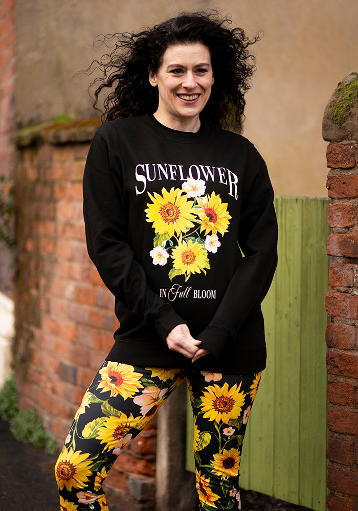 Ninth angle of Sunflower Print Sweatshirt (Black), sunflower Print Sweatshirt (Black) Your go-to feel-good layer.