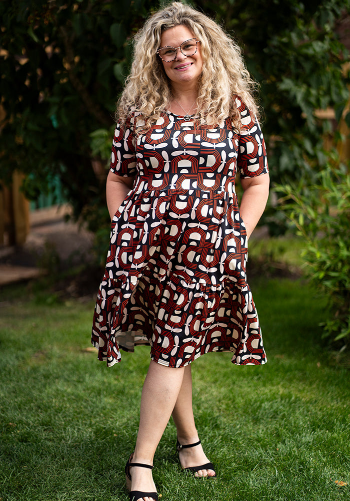 Front view of Sunniva Retro Floral Print Tiered Hem Dress