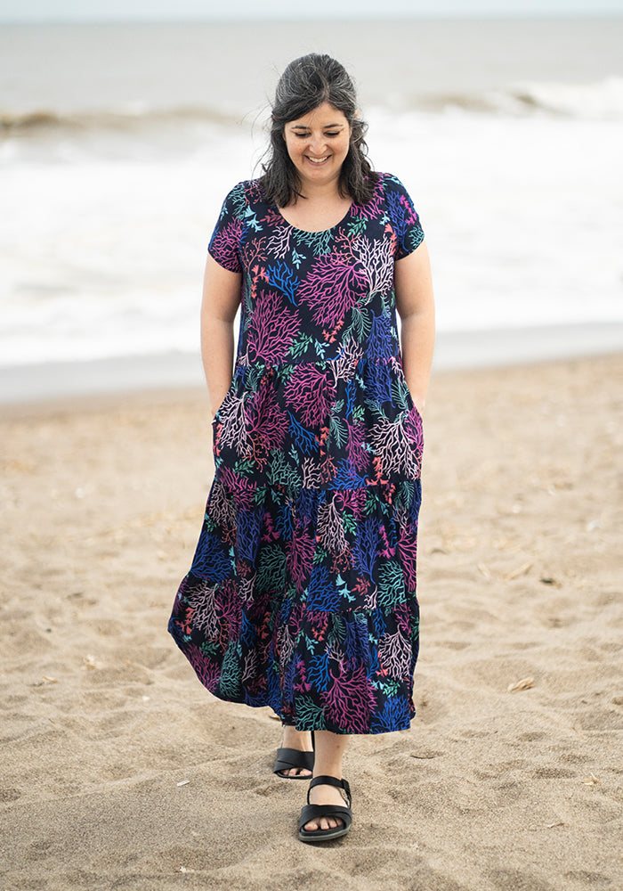 Front view of Tahila Coral Print Tiered Hem Relaxed Fit Viscose Midi Dress