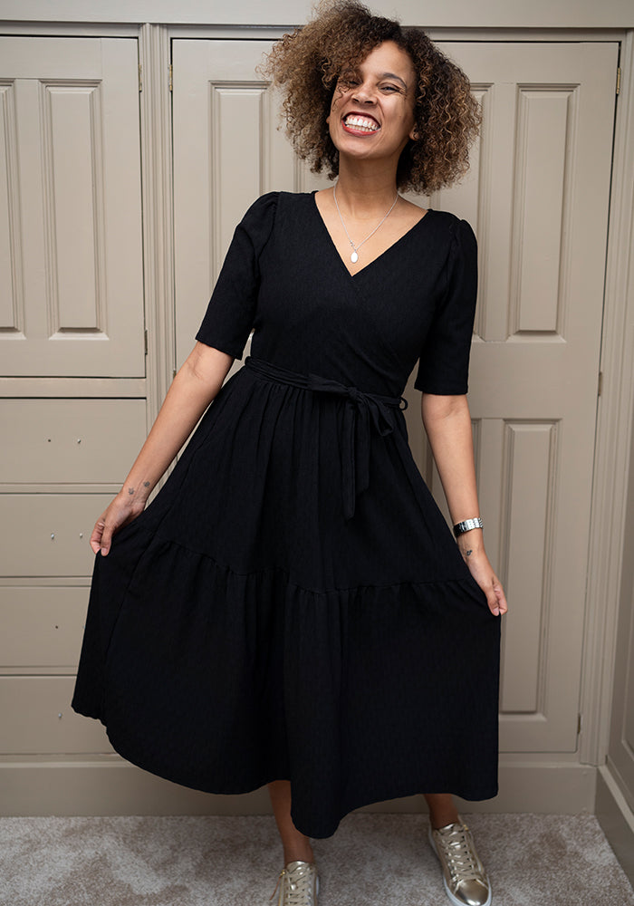 Fourth angle of Tate Black Oval Textured Tiered Hem Midi Dress