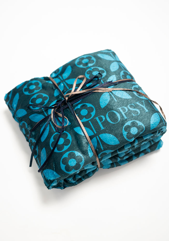 Eighth angle of Teal Retro Flower Print Pop-under Plush Blanket