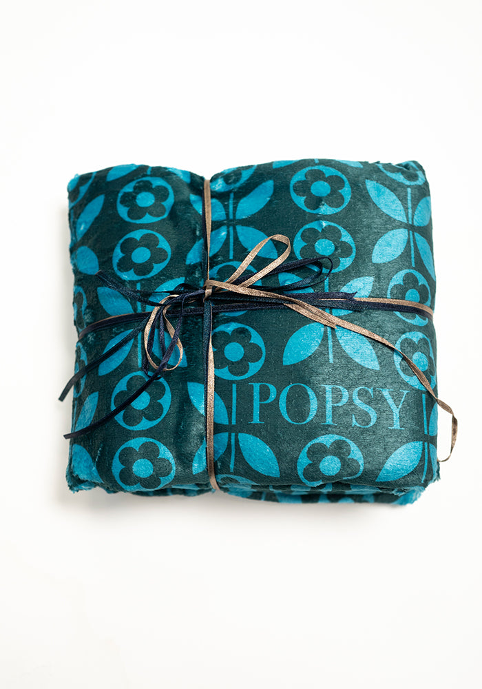 Third angle of Teal Retro Flower Print Pop-under Plush Blanket