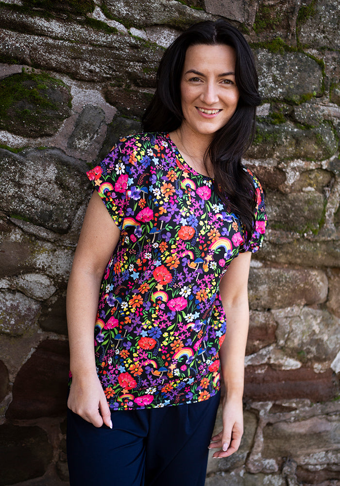 Front view of Tess Garden Rainbow Print Extended Shoulder Top