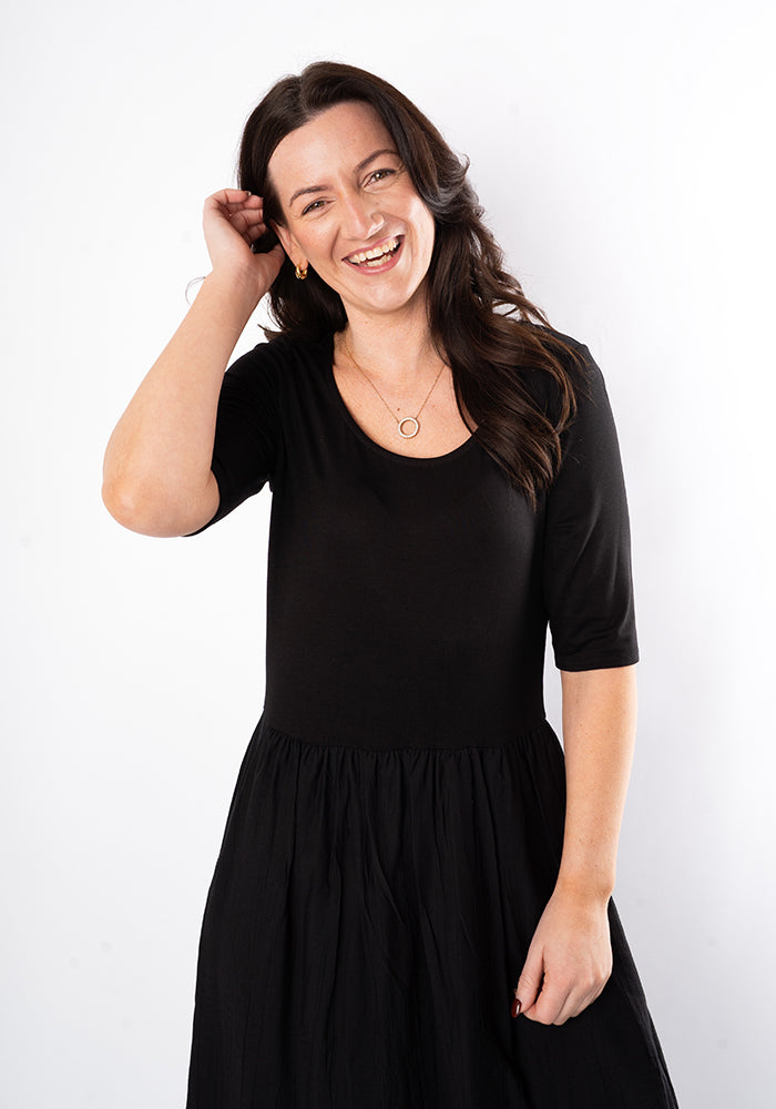Third angle of Vara Mixed Fabric Midi Dress (Black)