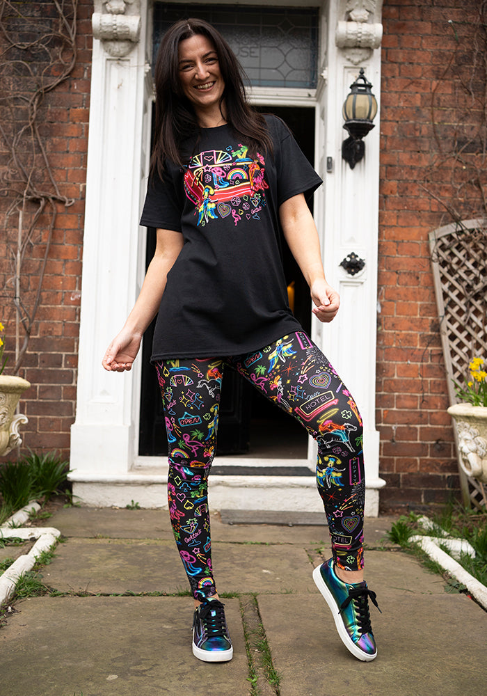 Third angle of Vegas Graphic Print T-Shirt, a black tee with a neon Vegas inspired graphic.