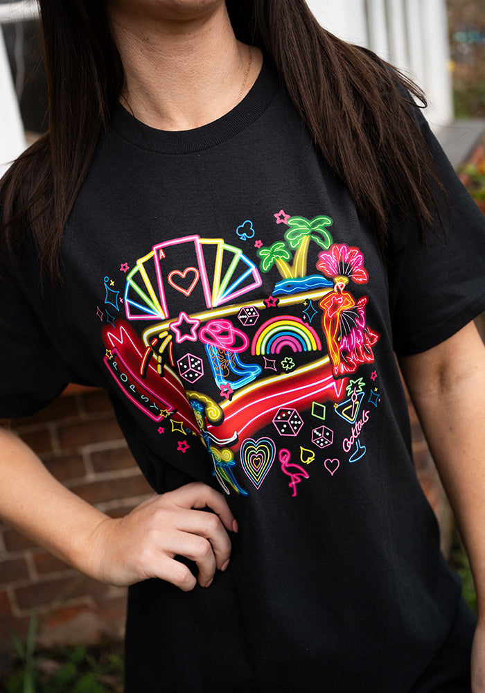 Front view of Vegas Graphic Print T-Shirt, a black tee with a neon Vegas inspired graphic.