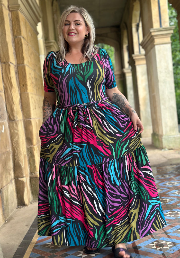 Front view of Zena Bright Animal Print Tiered Hem Midaxi Dress