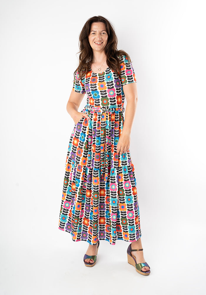 Woman wearing a colourful patterned dress 