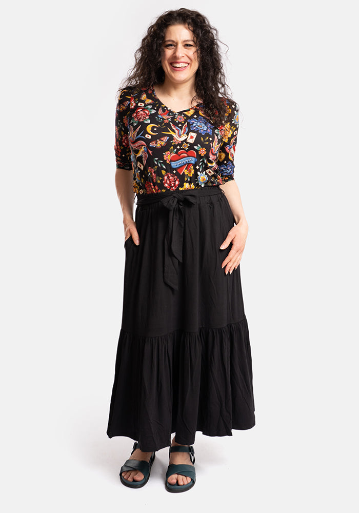 Front view of Bina Black Tiered Hem Viscose Midi Skirt