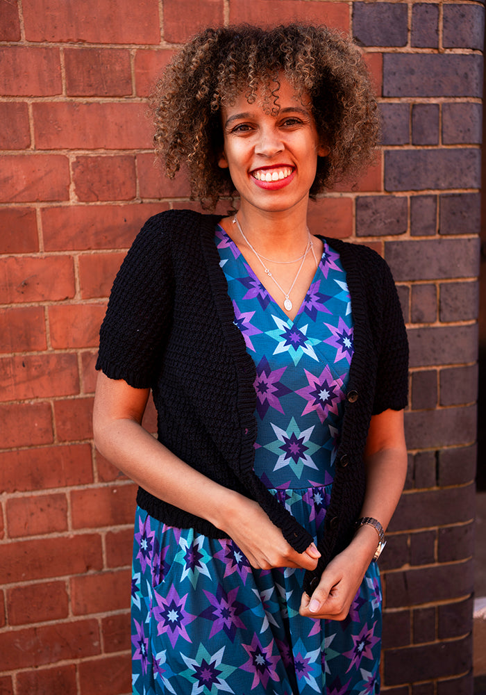 Front view of Black Scallop Short Sleeve Cardigan