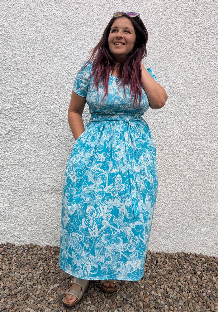 Front view of Yira White Butterfly Stencil Print Midi Length Jersey Skirt