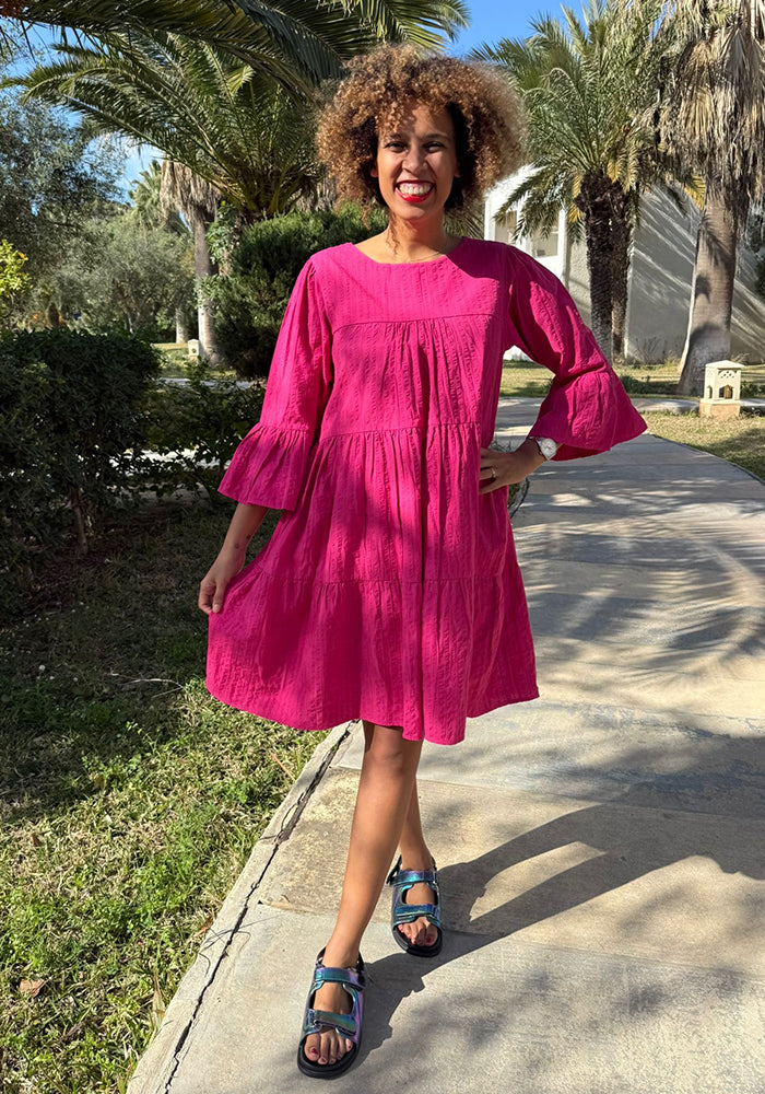 Front view of Mayliss Pink Textured Woven Cotton Tiered Dress