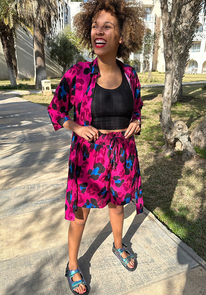 Front view of Lue Large Scale Pink Animal Print Woven Shorts