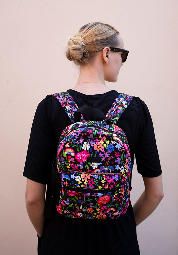 Front view of Garden Rainbow Floral Print Mini Backpack